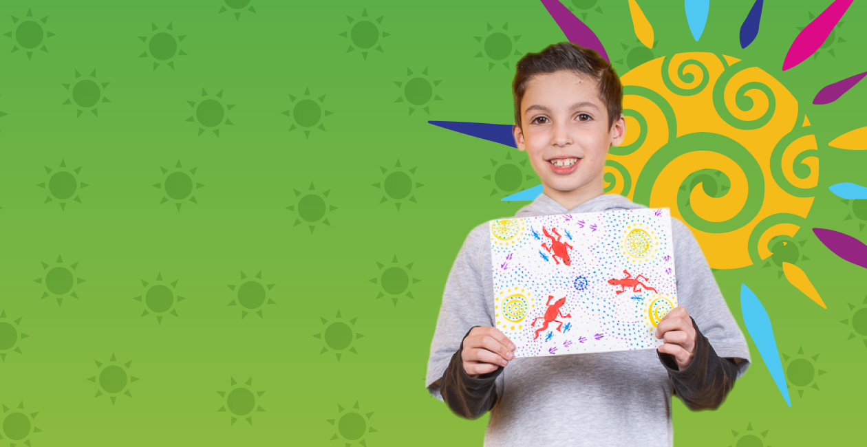 Happy camper showing lizard project at Crayola Imagine Arts Academy camp in Oakland County