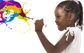 Girl using a marker with colorful paint splashes — hands-on Crayola programs for kids